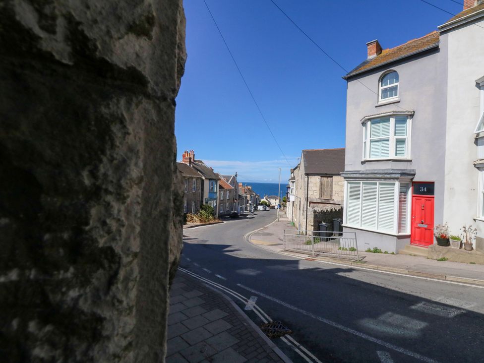 A street view with houses and the ocean in the distance at 57 High Street, Portland