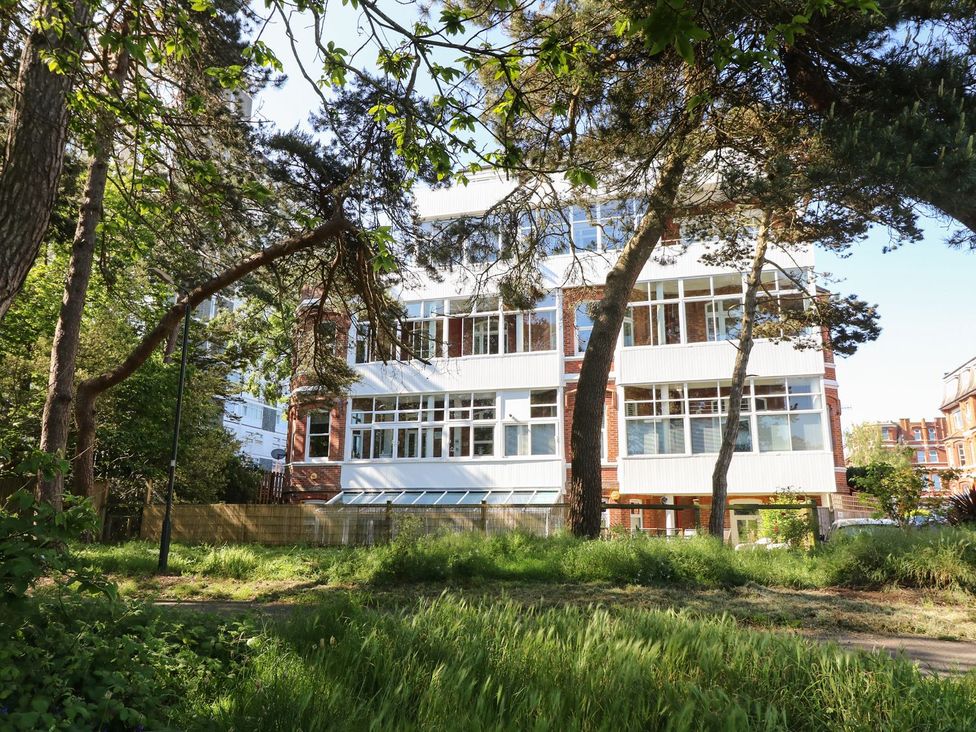 A building with windows and trees in front at The Pines Bournemouth