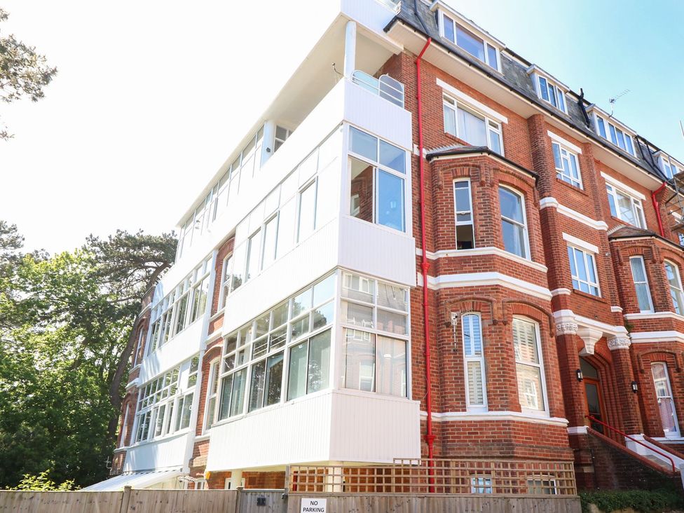 A building with multiple windows and brick facade at The Pines in Bournemouth