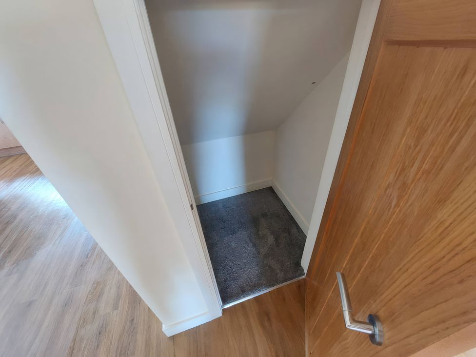 A closet with a carpeted floor at Wold View in Market Rasen