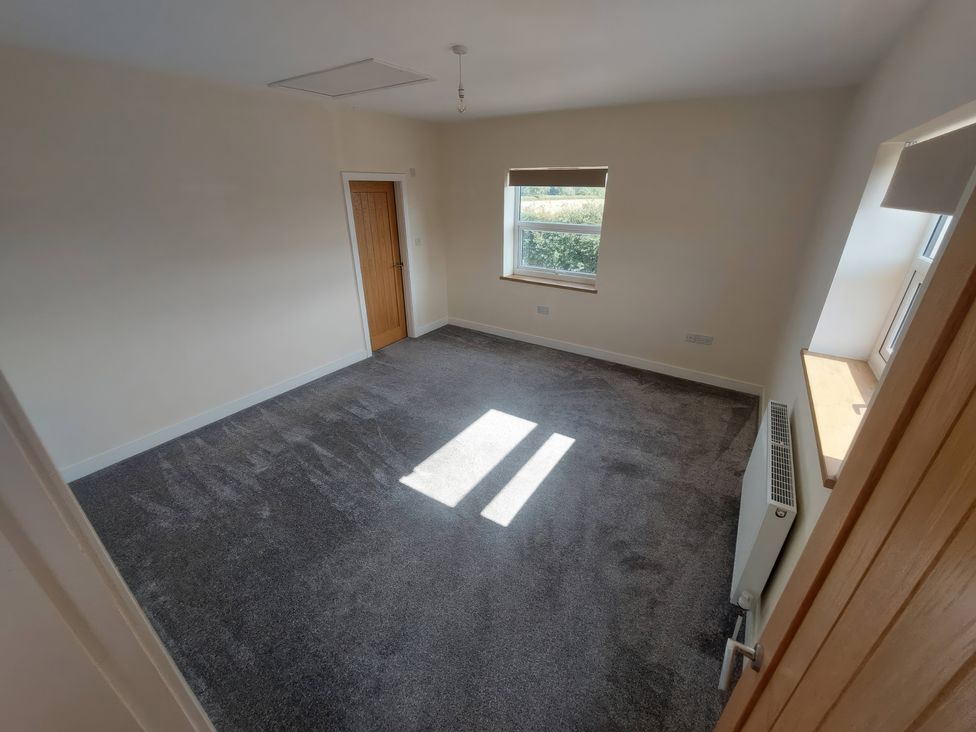 A room with a window and radiator at Wold View in Market Rasen