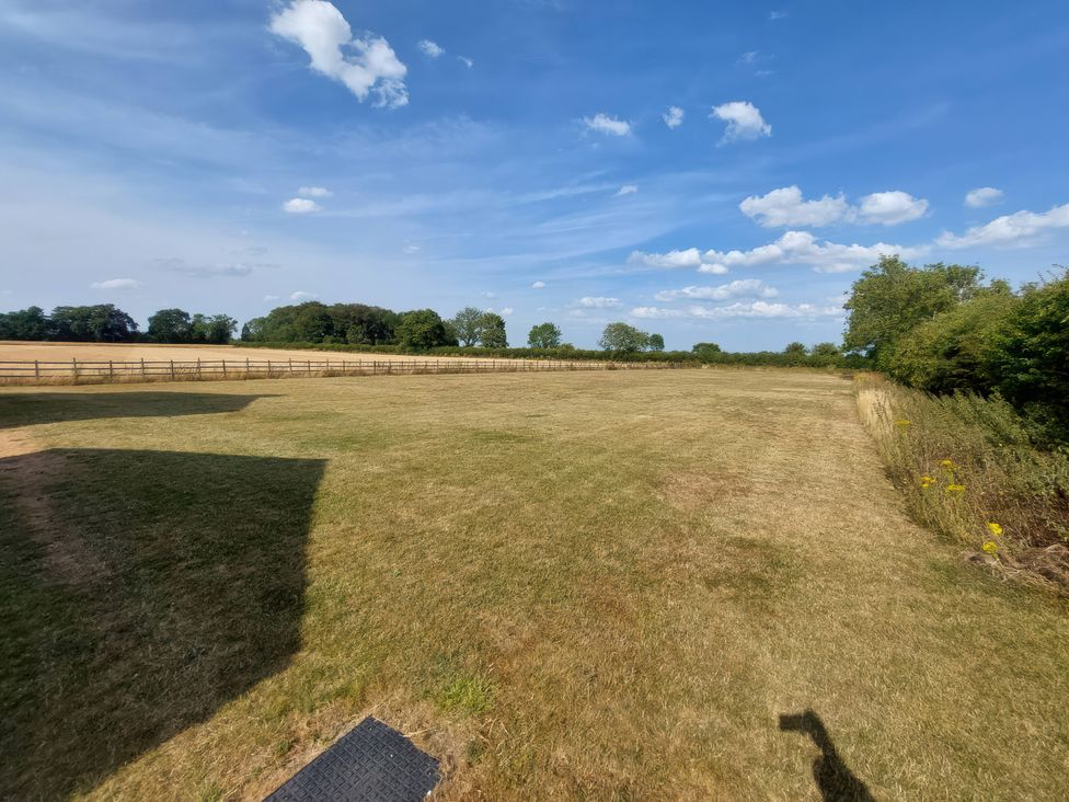 A field with grass and trees at Wold View in Market Rasen