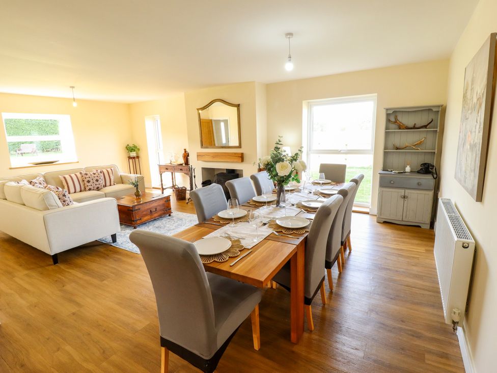 A dining room with a table set for dinner at Wold View near Caistor