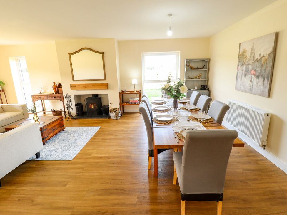 A dining room with a table set for a meal at Wold View near Caistor