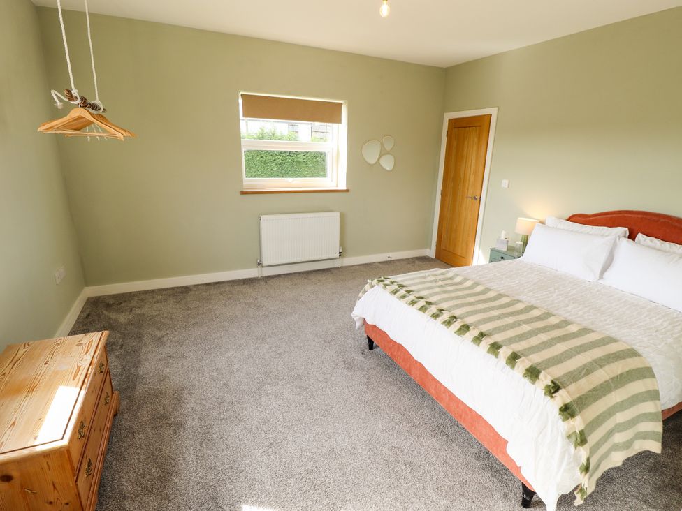 A bedroom with a bed and window at Wold View near Caistor