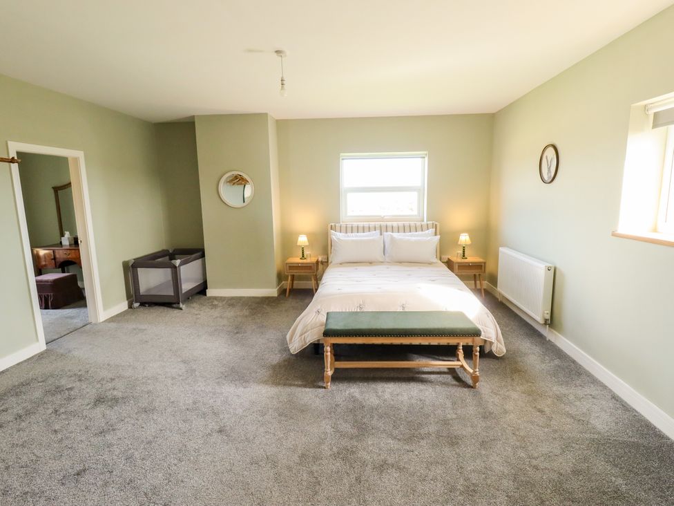 A bedroom with a bed and a nightstand at Wold View near Caistor