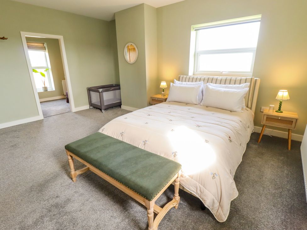 A bedroom with a bed and bedside tables at Wold View near Caistor
