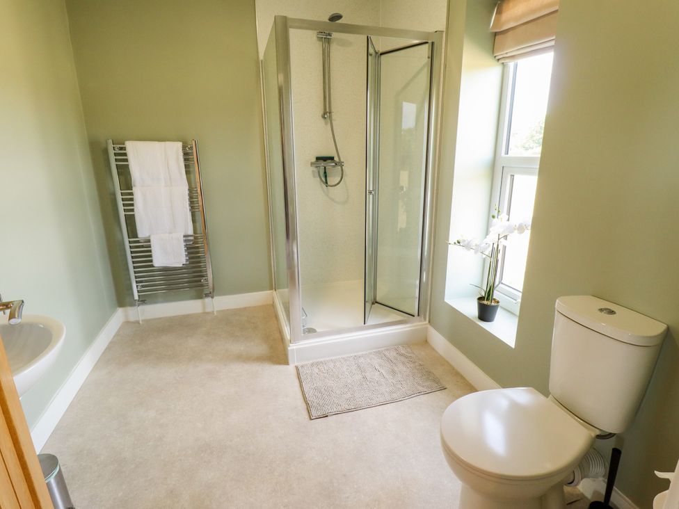 A bathroom with a shower and toilet at Wold View near Caistor