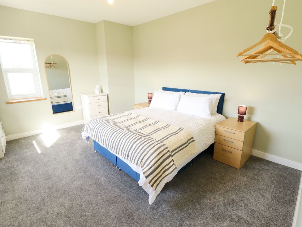 A bedroom with a bed and nightstand at Wold View near Caistor