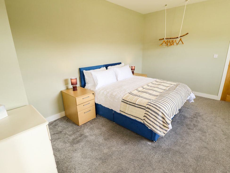A bedroom with a bed and furniture at Wold View near Caistor