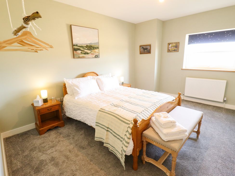 A bedroom with a bed and bedside table at Wold View near Caistor