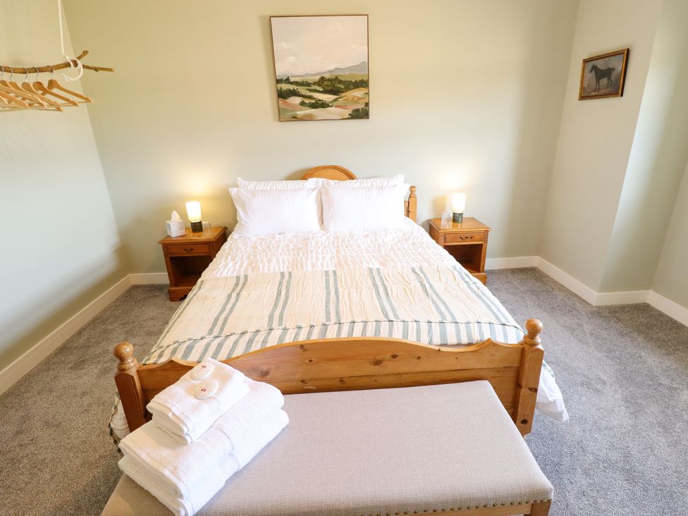 A bedroom with a bed and bedside tables at Wold View near Caistor