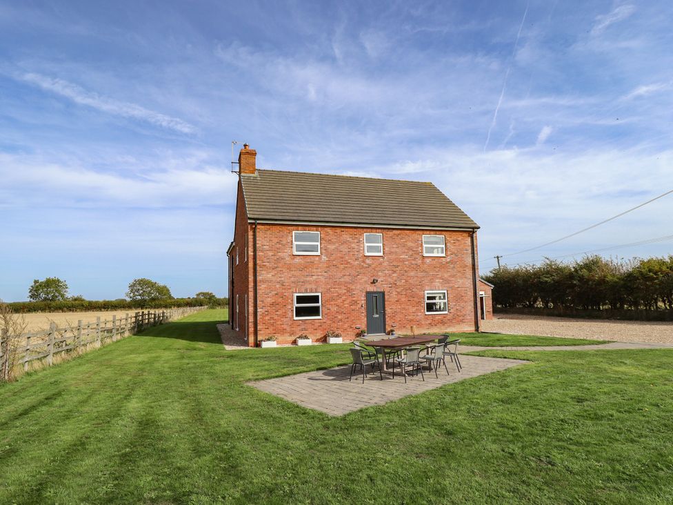 A house with a patio and seating area at Wold View near Caistor