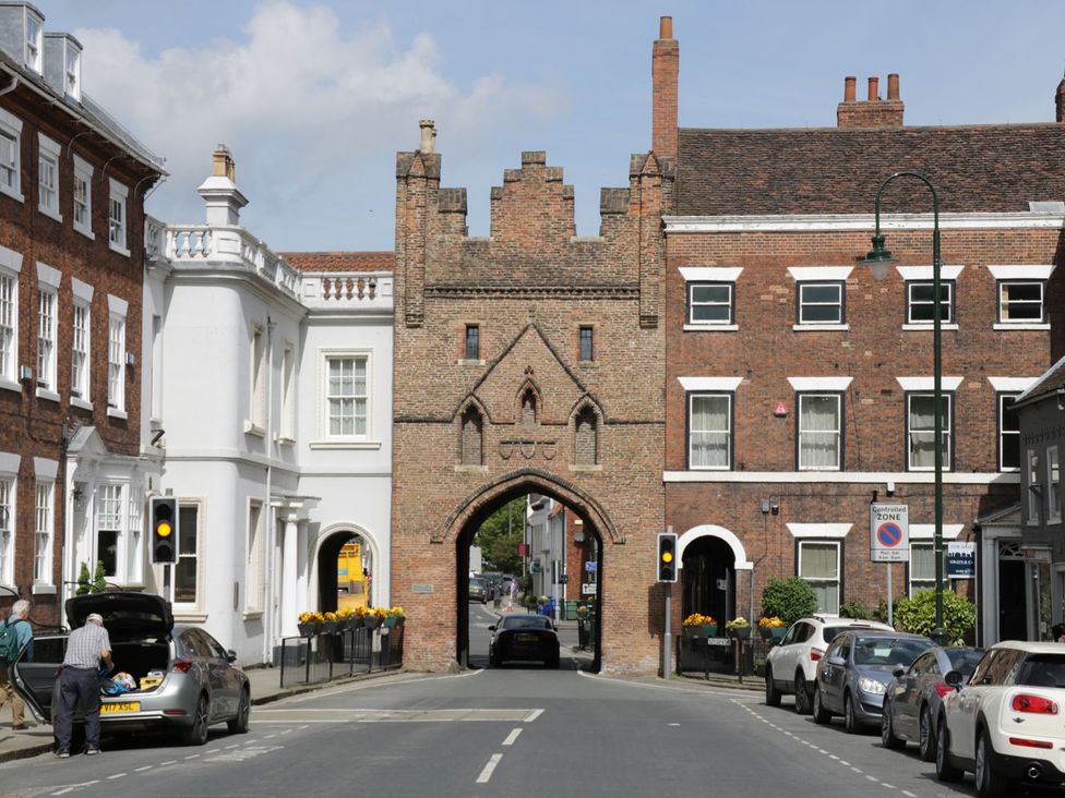 An archway flanked by buildings on a street in Beverley