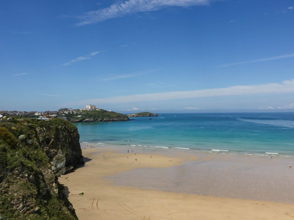 A beach view with cliffs and sea at Seaside Retreat in Newquay