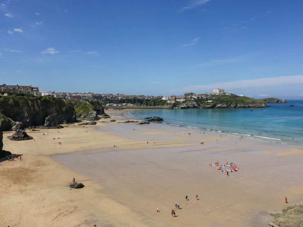 A beach scene with people and water at Seaside Retreat in Newquay
