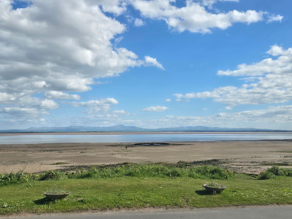 A view of a beach and hills at Sandy Toes, Powfoot, Annan