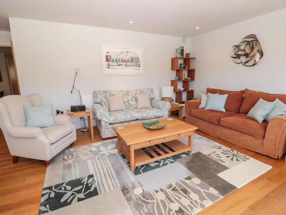 A living room with a sofa and armchair at 33 Dart Marina Dartmouth