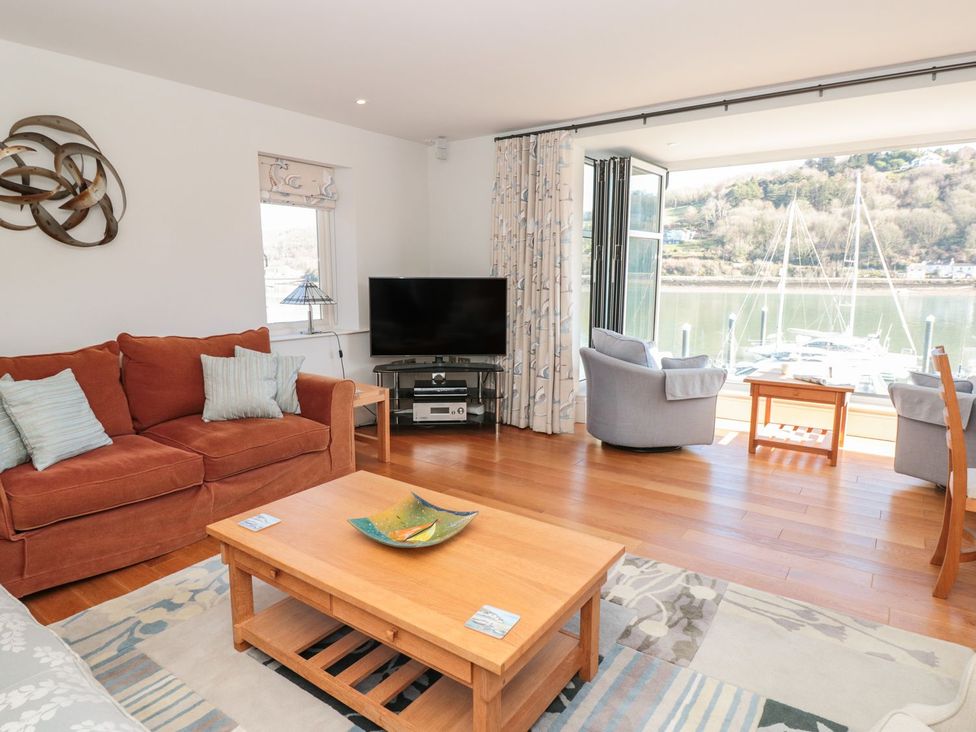 A living room with a sofa and coffee table at 33 Dart Marina in Dartmouth