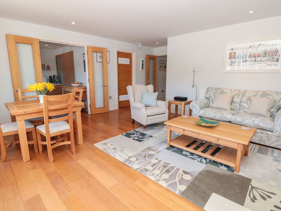 A living room with a table and chairs at 33 Dart Marina Dartmouth
