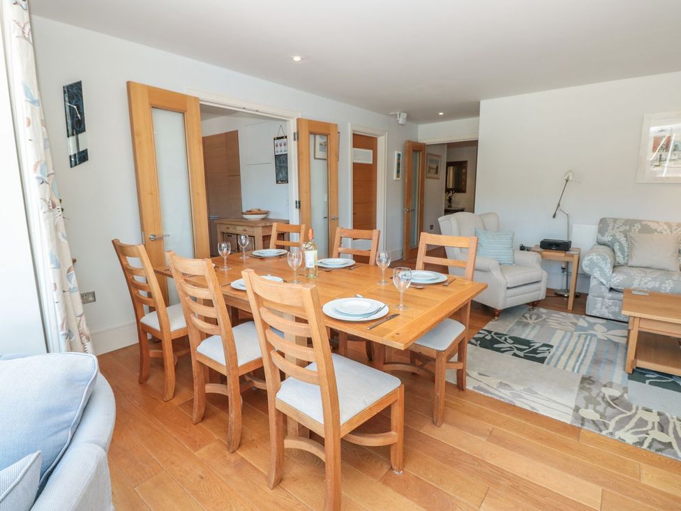 A dining room with a table and chairs at 33 Dart Marina Dartmouth