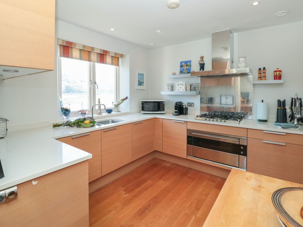 A kitchen with a sink and appliances at 33 Dart Marina in Dartmouth