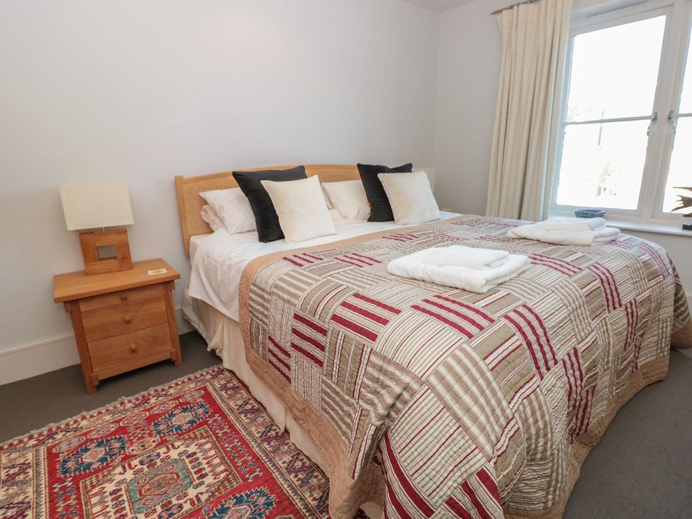 A bedroom with a bed and bedside table at 33 Dart Marina Dartmouth