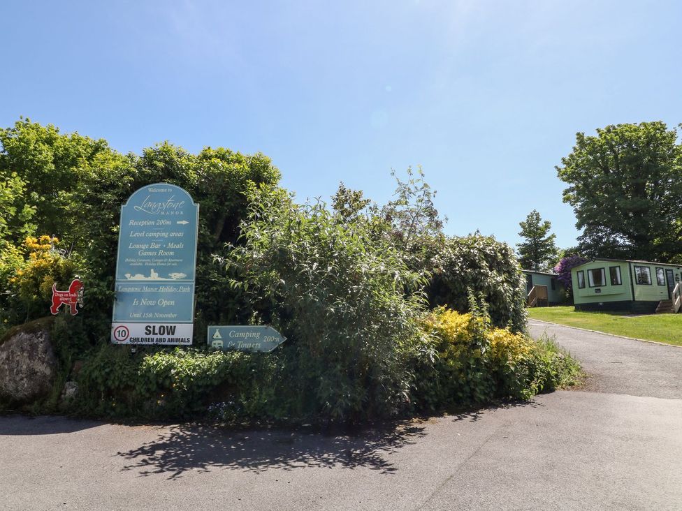 Outdoor area with signage for a camping site at Lazy Hills in Tavistock