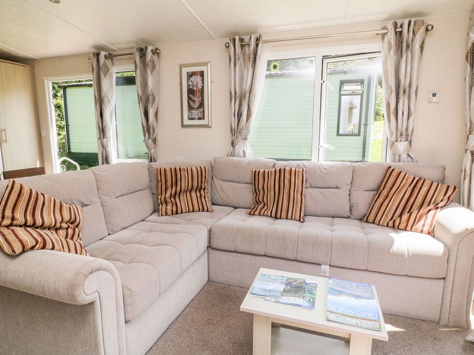 A living room with a sofa and coffee table at Great Mis Tour in Tavistock