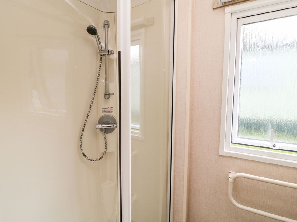 A shower with a window in the bathroom at Great Mis Tour in Tavistock