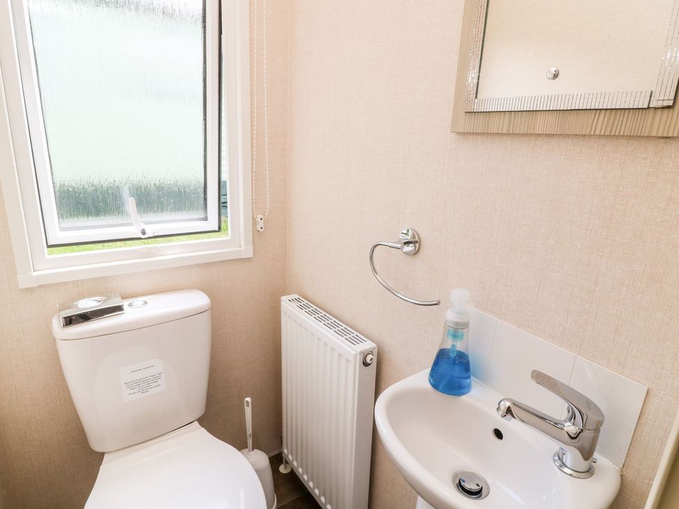 A bathroom with a toilet and sink at Great Mis Tour, Tavistock