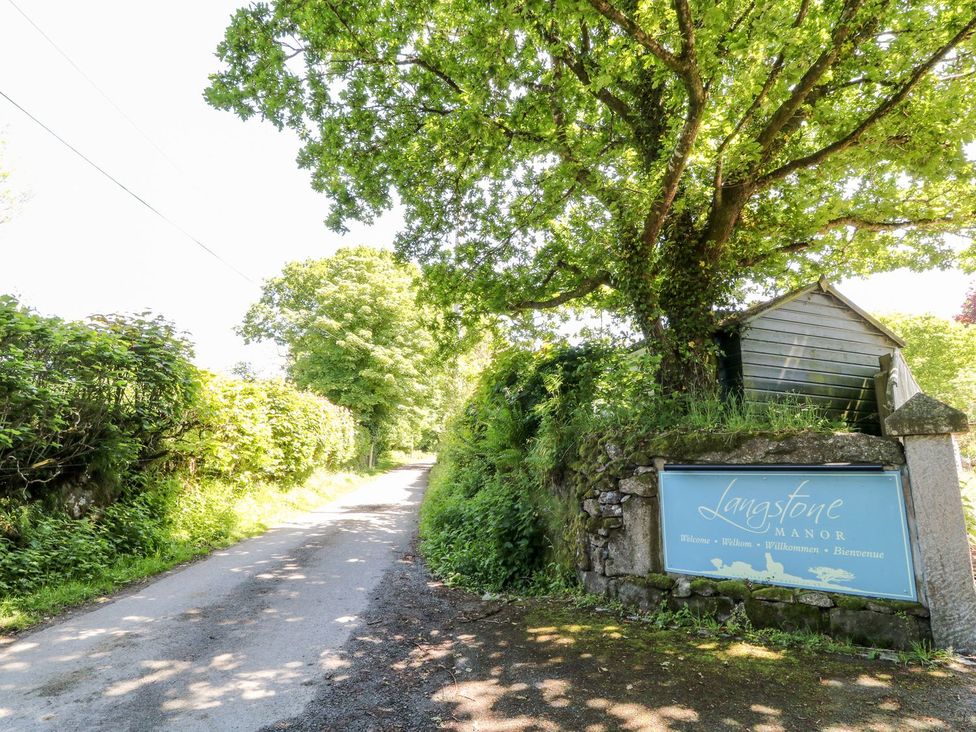 A sign for Langstone Manor at an outdoor location in Tavistock