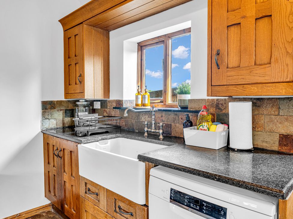 A kitchen with a sink and cabinets at Oxhay Barn Newcastle