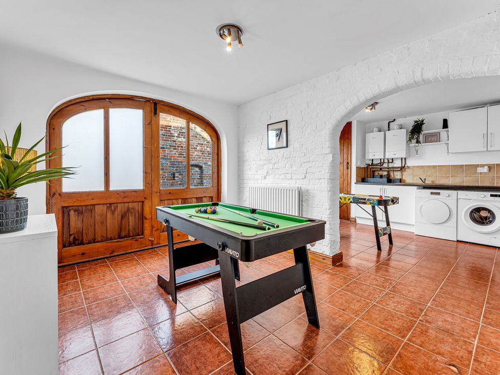 A game room with a pool table and washing machine at Oxhay Barn Newcastle