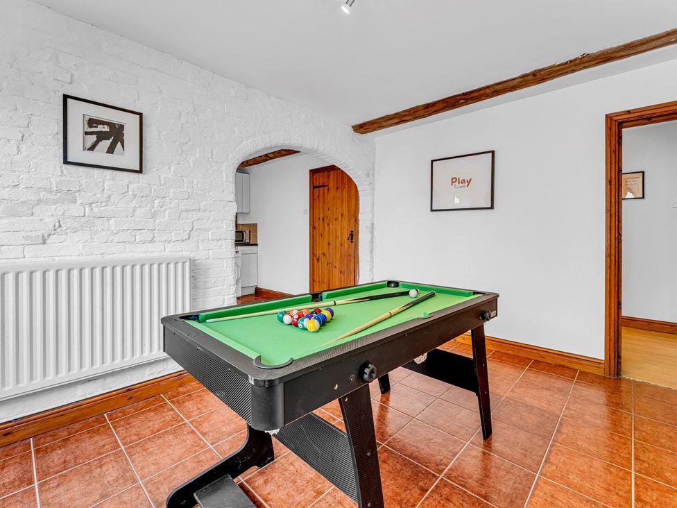 A game room with a pool table and kitchenette at Oxhay Barn Newcastle