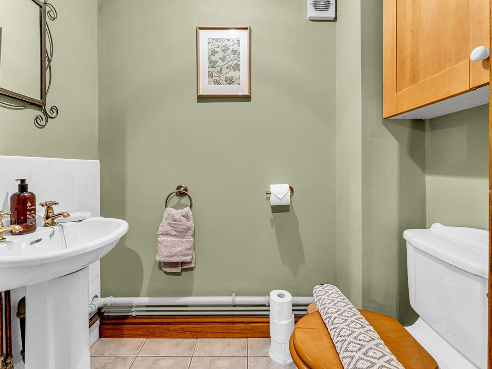 A bathroom with a sink and toilet at Oxhay Barn Newcastle