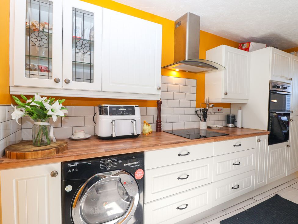 A kitchen with appliances and a countertop at Angels Place in Yelverton