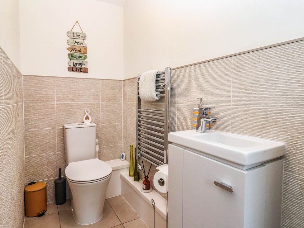 A bathroom with a toilet and sink at Blanket Row in Hull