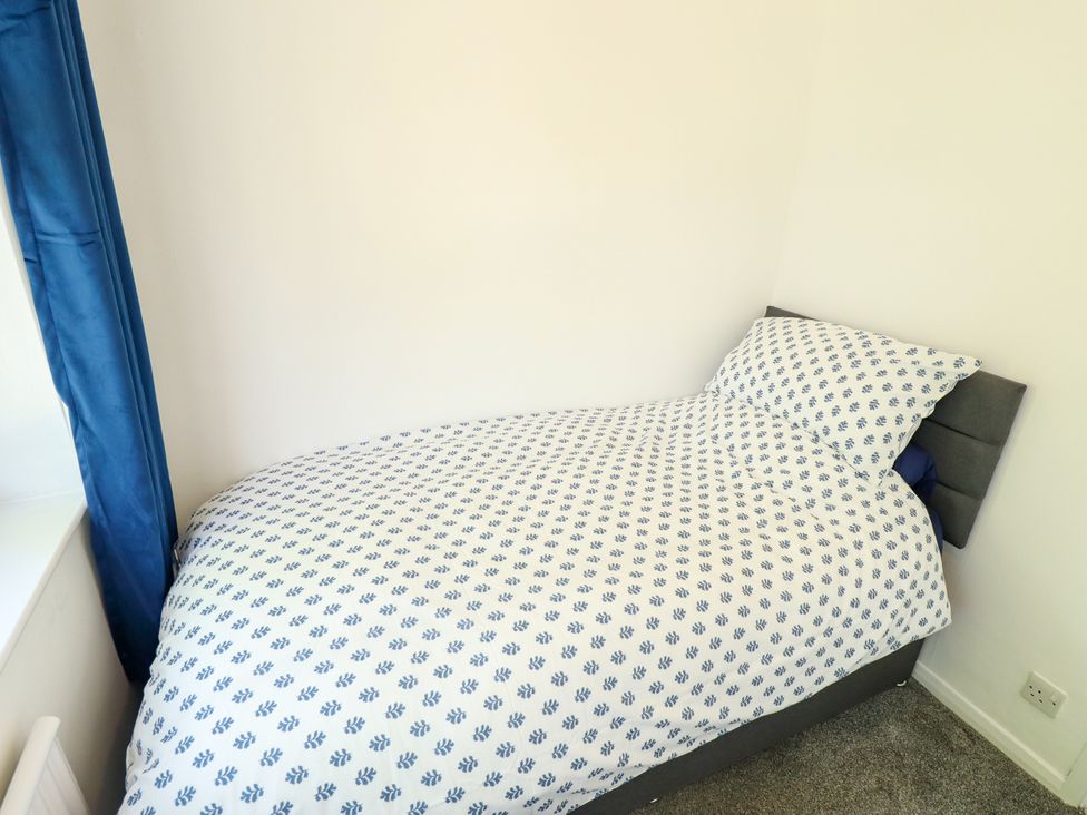 A bedroom with a bed and window at Mariner's Nook in Cleethorpes