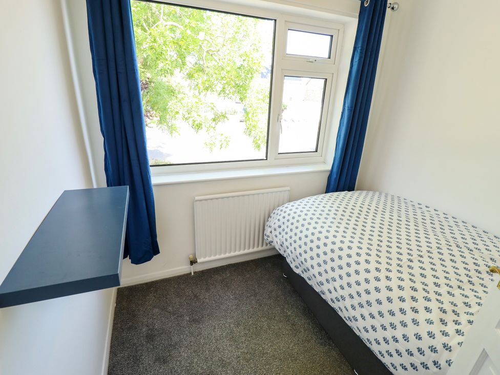 A bedroom with a bed and a window at Mariner's Nook in Cleethorpes