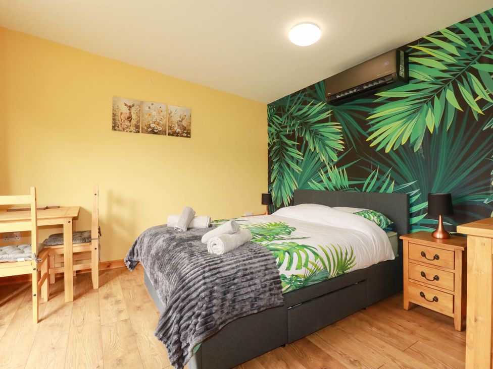 A bedroom with a bed and dining table at The Hyde, Tazamble cottage Launceston