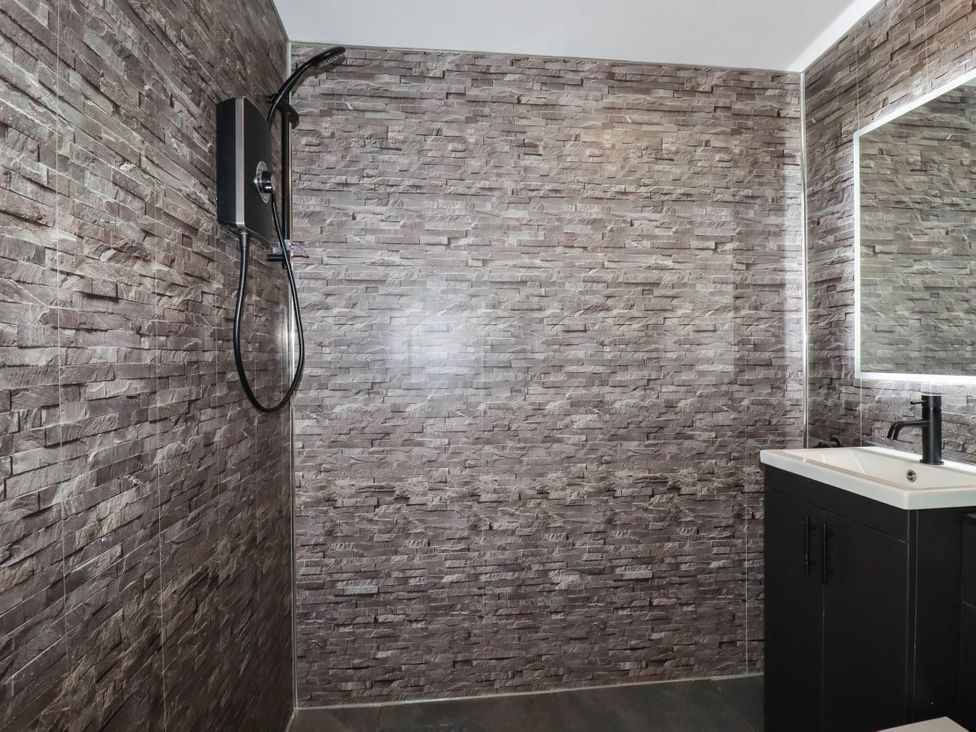 A bathroom with a shower and sink at The Hyde, Tazamble cottage Launceston