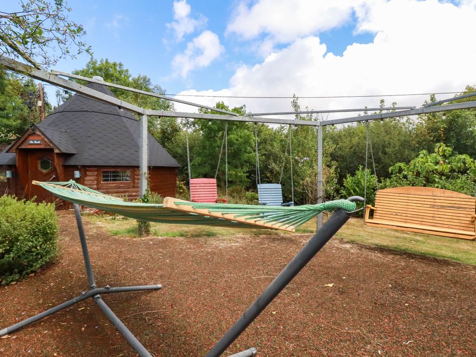 An outdoor area with a hammock and swings at The Hyde, Tazamble cottage in Launceston
