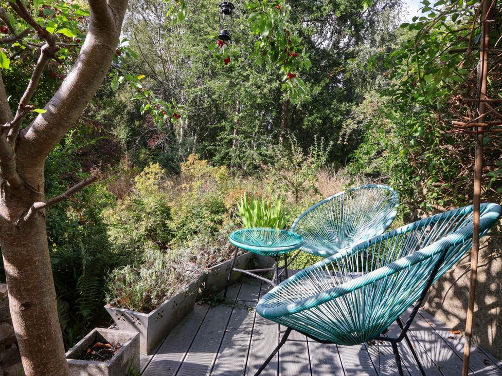 A garden with chairs and a table at Bowdery in Harrogate