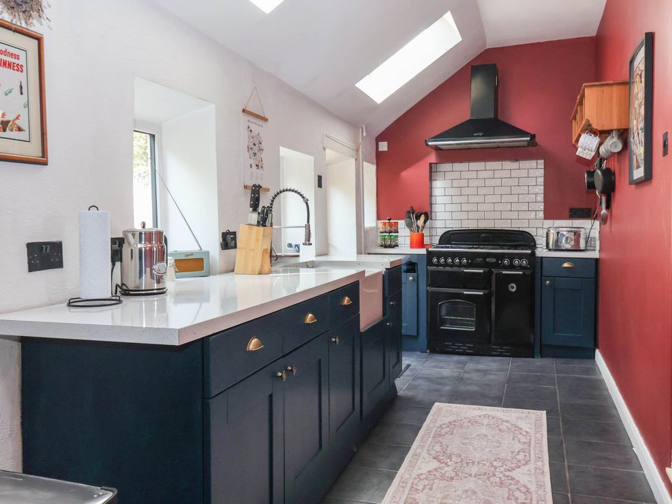 A kitchen with cabinets and a cooker at Bowdery in Harrogate