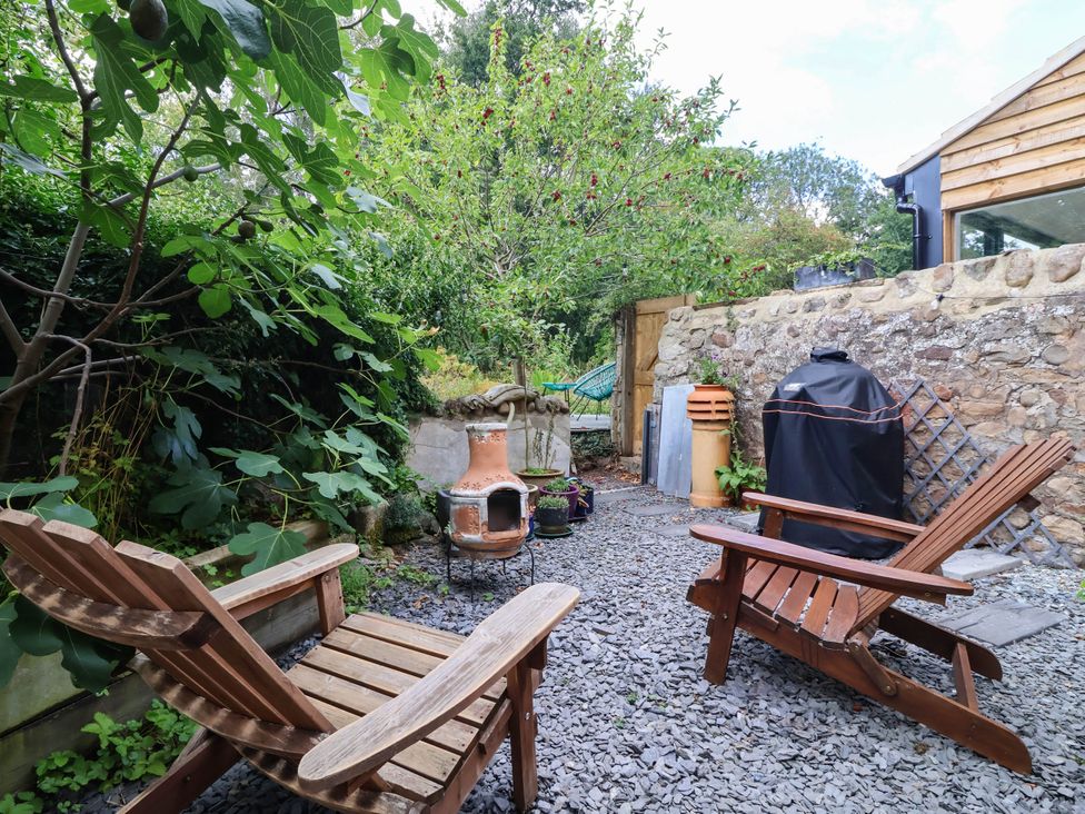 A garden with chairs and a chiminea at Bowdery in Harrogate
