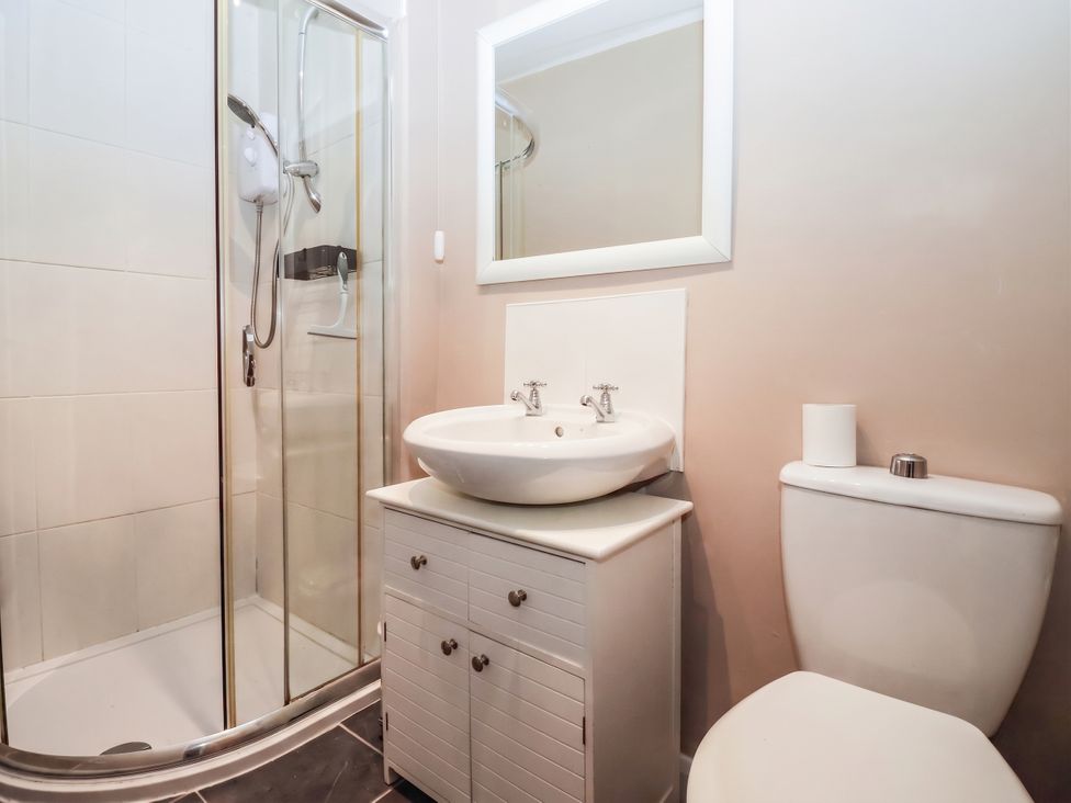 A bathroom with shower, sink, and toilet at Bowdery in Harrogate