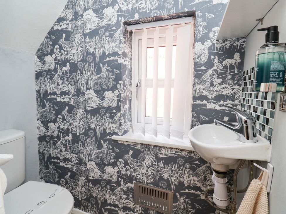 A bathroom with a sink and toilet at Laburnum house in Ellesmere Port