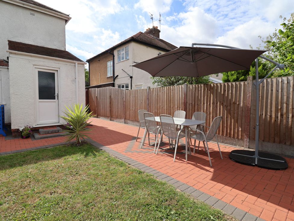 A garden with a patio table and chairs at Laburnum house in Ellesmere Port