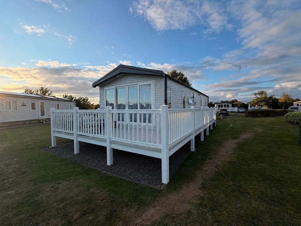 A holiday home with a deck in an outdoor area at Haggerston Castle - Lakeside Retreat, Berwick-upon-Tweed